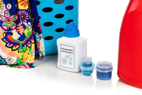 Close-up comparison of regular and concentrated laundry liquid detergent next Stock Photos