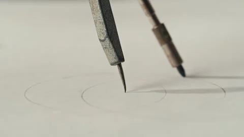 Close-up of compass drawing on white paper macro. Making some circle and Stock Footage 276112048
