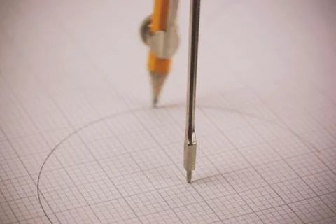 Close up of a compass on graph paper Foto stock