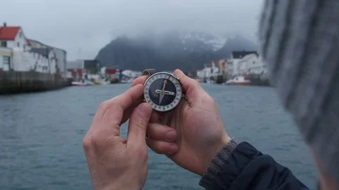 Close up on compass instrument in gloved hand . Mountain hiking trails. Winter Stock Footage 109195578