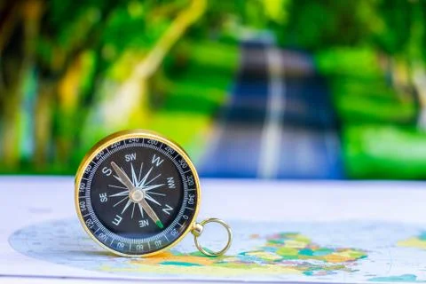 Close up compass on paper map, travel and lifestyle, manage to success busine Stock Photos