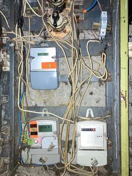 Close-up of a complex, multi-layered electrical panel with assorted meters,.. Stock Photos