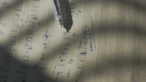 Close up of a composer's handwritten musical notation on an old manuscript Stock Footage 346800074