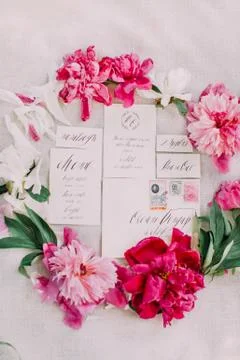 The close-up composition of the beautiful postcards and envelopes surrounded by Stock Photos