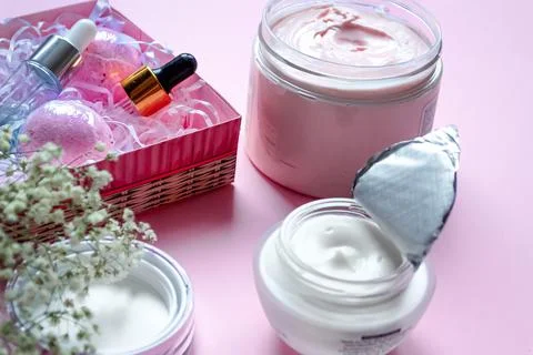 Close-up composition of face and body care on pink background, cosmetic Stock Photos