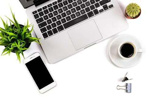 Close-up composition of office workspace with white smartphone Stock Photos