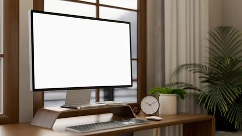 A close-up of a computer and decor placed on a wooden table, set in a cozy .. Illustrazione stock