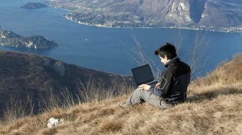 Close the computer and watch the spectacular scenery Stock Footage 59715286