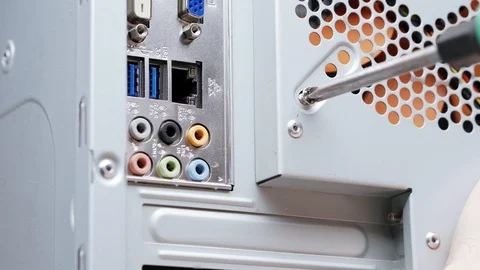 Close-up computer assembly. A male service worker installs a fan in a PC case Stock Footage 105422869