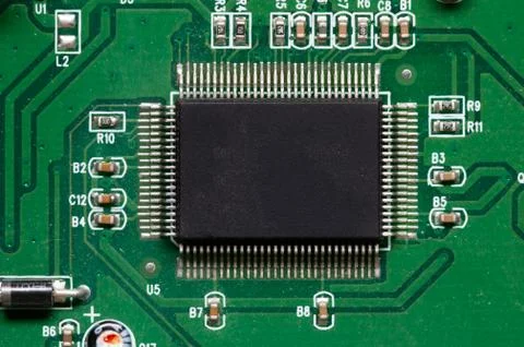 Close-up of computer chip on green pc motherboard microchip Stock Photos