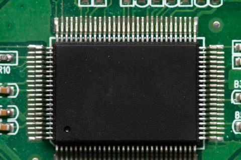 Close-up of computer chip on green pc motherboard microchip Stock Photos