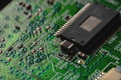 Close-up of computer chip on green pc motherboard microchip Stock Photos