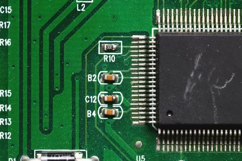 Close-up of computer chip on green pc motherboard microchip Stock Photos