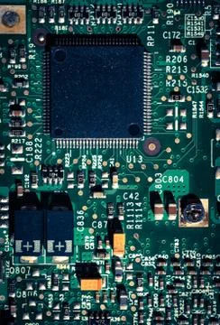 Close-up on computer circuit board chips, cross processed effeck colour Stock Photos