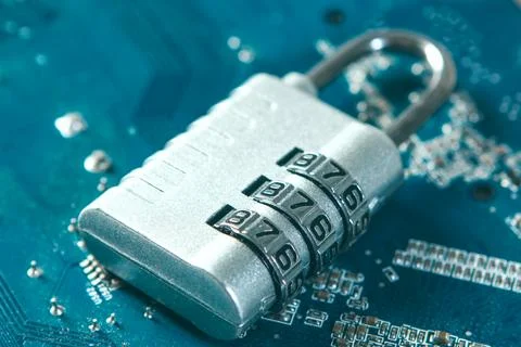 Close up of a computer circuit board with a padlock on it Foto stock