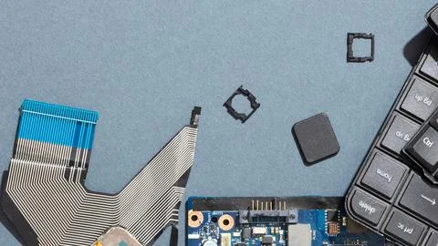 Close up of computer components and ribbon cables on a blue surface Stock Photos