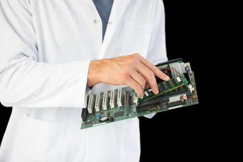 Close up of computer engineer holding hardware at night Stock Photos