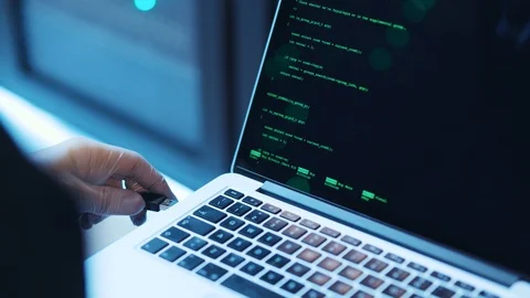 Close-up of computer hacker connecting to database server, coding password on Stock Footage 120693819