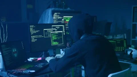 Close-up of computer hacker typing a code to break the server. Failing attempt Stock-Fotos