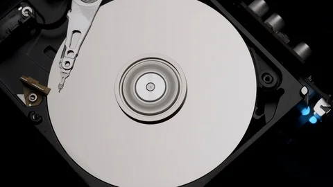Close-Up Computer Hard Disk Drive Spin and Write. Rotation Stop. Blue Lights 4k Stock Footage 129519552