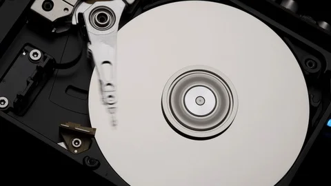 Close-Up Computer Hard Disk Drive Spin and Write. Rotation Stop. Blue Lights 4k Stock Footage 129519670