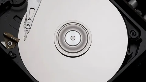 Close-Up Computer Hard Disk Drive Spin and Write. Rotation Stop. Blue Lights 4k Stock Footage 129519744