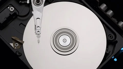 Close-Up Computer Hard Disk Drive Spinning,  Writing Blue Lights Slow Motion Stock Footage 129607375