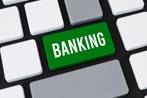 Close-up of a computer keyboard featuring a prominent green key with white .. Stock Photos