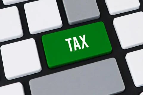 Close-up of a computer keyboard with a green key and white text that reads .. Stock Photos