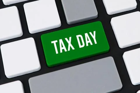 Close-up of a computer keyboard with a green key and white text that reads .. Stock Photos