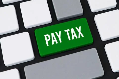 Close-up of a computer keyboard with a green key and white text that reads .. Stock Photos