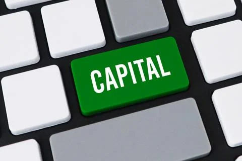 Close-up of a computer keyboard with a green key and white text that reads .. Stock Photos