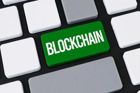 Close-up of a computer keyboard with a green key and white text that reads .. Stock Photos