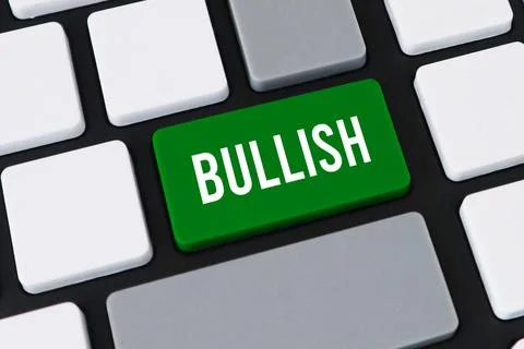 Close-up of a computer keyboard with a green key and white text that reads .. Stock Photos