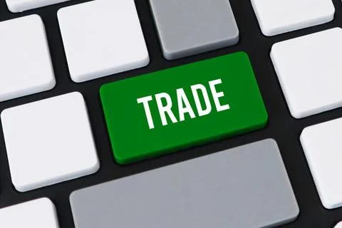 Close-up of a computer keyboard with a green key and white text that reads .. Stock Photos