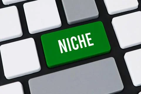Close-up of a computer keyboard with a green key and white text that reads .. Stock Photos