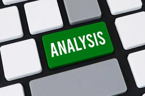 Close-up of a computer keyboard with a green key and white text that reads .. Stock Photos