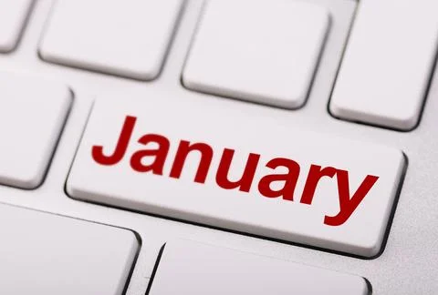 Close-up of a computer keyboard with a key labeled "January" in red, symbol.. Stock Photos