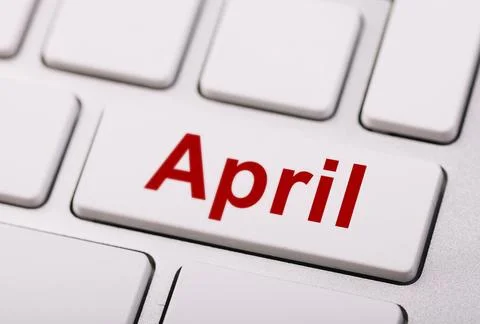 Close-up of a computer keyboard with a key labeled "April" in red, symboliz.. Stock Photos