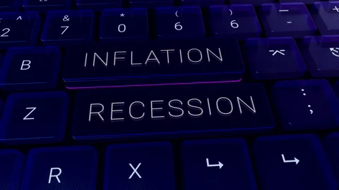 Close up of a computer keyboard with keys labeled inflation and recession Stock Footage 266686172