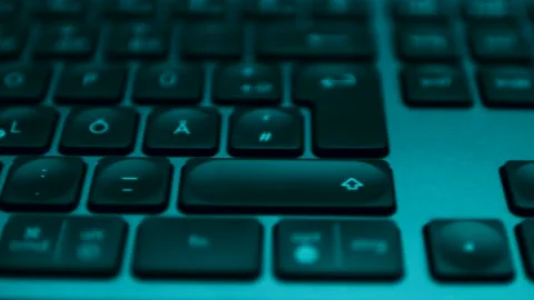 Close Up of a Computer Keyboard at Night Stock Footage 169077128