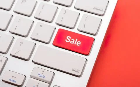 Close-up of computer keyboard with red sale button Stock Photos