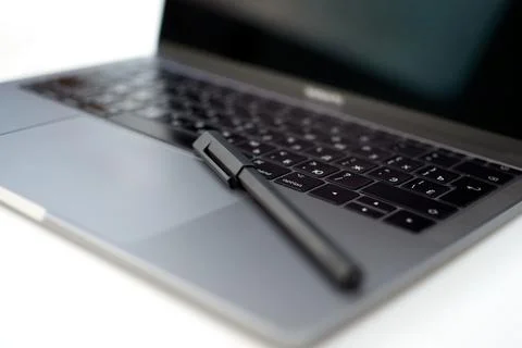 Close-up computer laptop keyboard, pen and pencil Stock Photos