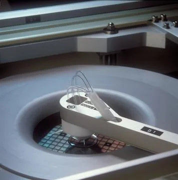 A close up of a computer microchip wafer being manufactured Stock Photos