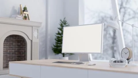 A close-up of a computer mockup on a minimalist table in a contemporary whi.. Stock Photos