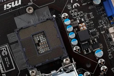 Close-up of a computer motherboard with chips and circuits Stock Photos