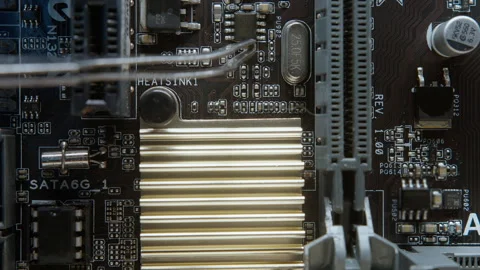 Close-up of a computer motherboard during electric current testing, showing.. Stock Footage 311337347
