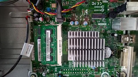 Close-up of a computer motherboard with RAM and heatsink detail. Stock Photos