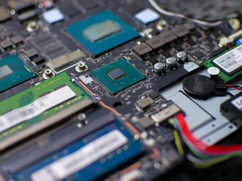 Close up of a computer motherboard showcasing CPU, RAM modules, and various e 스톡 사진
