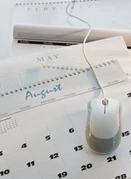 Close up of computer mouse on calendar Foto stock